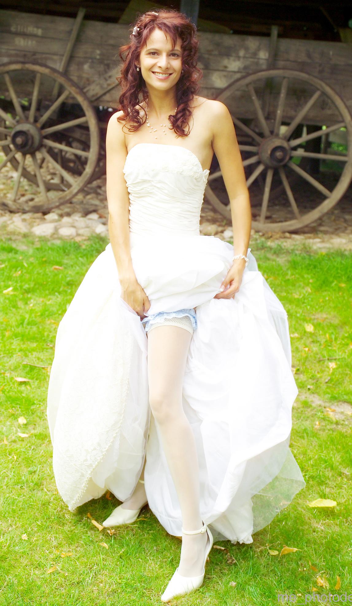 Young Redhead Bride wearing Sandal High Heels, White Opaque Stockings and White Long Dress